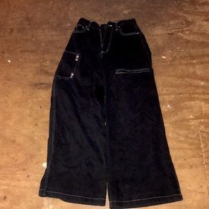 Long black jeans, used there is distressing in the back around the pocket